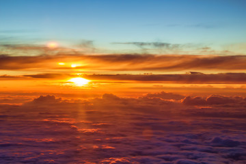 Beautiful orange sunset over the clouds.