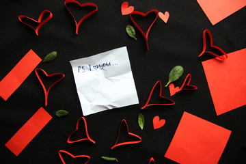 Red paper  hearts on the dark background