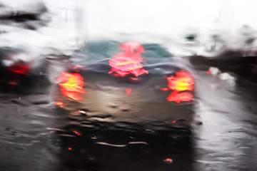 Car windshield during rain storm