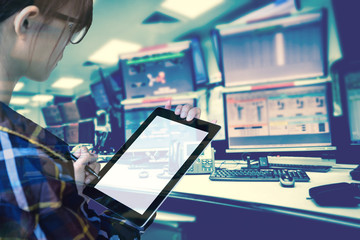 Double exposure of  women Engineer in hipster shirt  working with tablet in control room of oil and gas platform or plant industrial for monitor process, business and industry concept