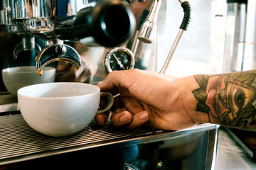 Baristas are coffee,by tattooed barista arm