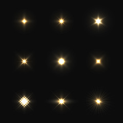 Set of vector lens flares isolated on black background.