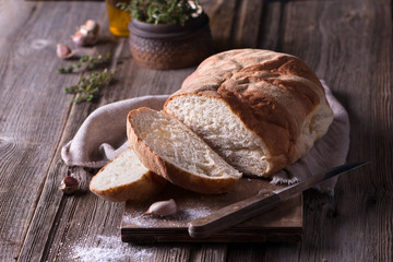 freshly baked homemade bread on wooden cutting board