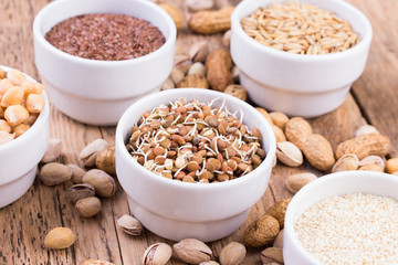 Bowls of various legumes and seeds.