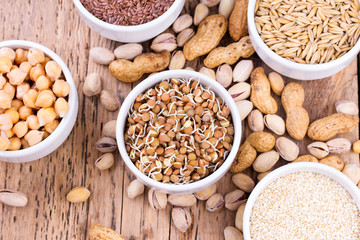 Bowls of various legumes and seeds.