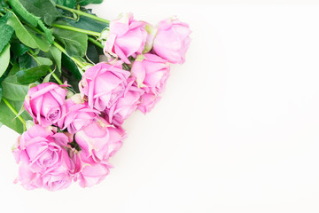 Valentines day violet fresh roses vouquet on beige background