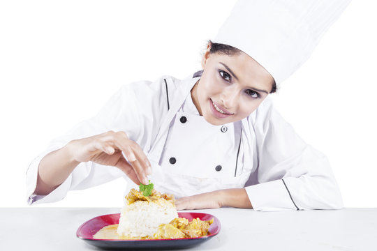 Indian chef with food in the studio