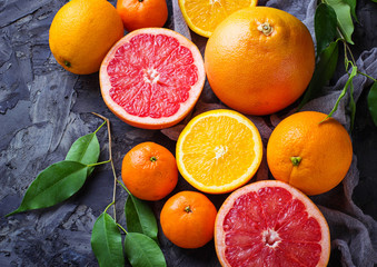 Dissected fresh fruits. Orange, grapefruit and tangerines