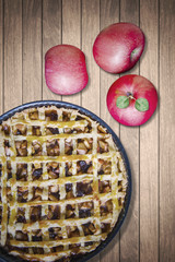 Pie and apple fruit on wooden table