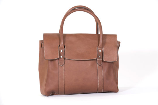 Fancy brown leather bag for fashionable women isolated on white.