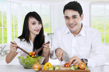 Vegetarian couple preparing healthy food