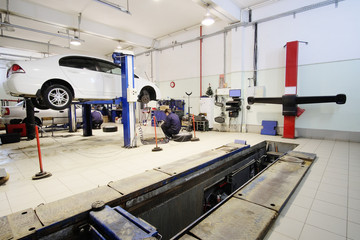 Wheel alignment equipment in a car repair station