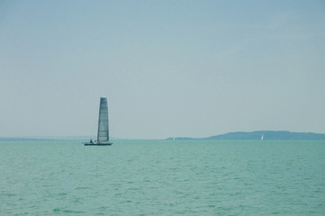 Yachting, luxury, sailing, cruise concept. A sailboat is waiting in day stillness under beautiful...