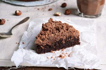 Chocolate Crumble Pie, Hazelnut Brownie on Beige and Wooden Background