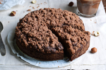 Chocolate Crumble Pie, Hazelnut Brownie on Beige and Wooden Background