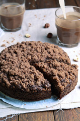 Chocolate Crumble Pie, Hazelnut Brownie on Beige and Wooden Background
