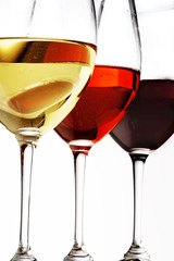 three different wine , red, white, rose with white background, close up