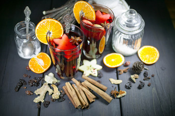 Christmas mulled wine on a dark wooden table-top