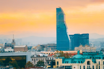 Tbilisi, Georgia. Skyscraper Surrounded By Buildings Of Soviet Time