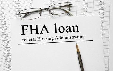 Paper with FHA loan on a table