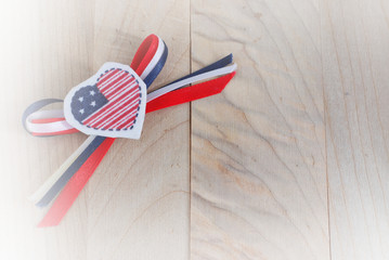 Image for Presidents Day in the United States of flag decoration on wooden background with white vignette applied. A big day for sales and deals and price reductions. Copy space.