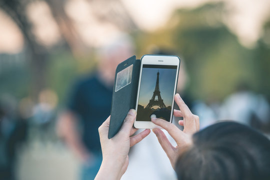 Man taking Smartphone Photo of Tour Eiffel - Paris