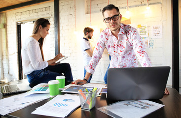 Startup Diversity Teamwork Brainstorming Meeting Concept.Business Team Coworker Global Sharing Economy Laptop Graph Screen.People Working Planning Start Up.Group Young Man Women Looking Report Office.