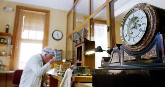 Horologist repairing a watch