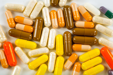 Various cold prescription bottles and a syringe isolated on a wh