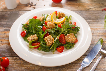 salad of arugula with cherry tomatoes and croutons