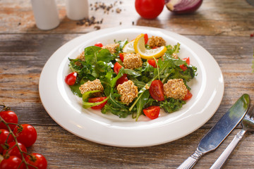 salad of arugula with cherry tomatoes and croutons