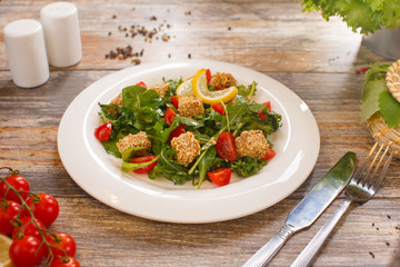 salad of arugula with cherry tomatoes and croutons