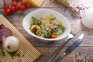 salad of arugula with cherry tomatoes and croutons