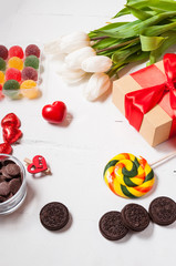 composition with tulips, sweets, candies and gift box. valentine's or mother' day.