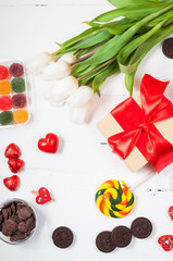 composition with tulips, sweets, candies and gift box. valentine's or mother' day