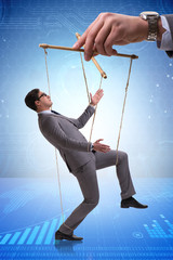 Businessman puppet being manipulated by boss