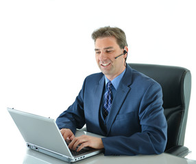 Business man on a call while working on laptop up or customer service representative helping people looking at laptop