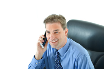 Business or sales man talking on the phone with a client looking up