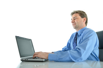 Business or sales man hard at work on his laptop