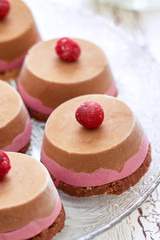 Raw vegan dessert with sour cherry served on glass plate