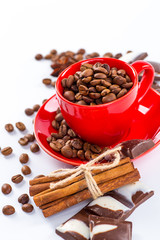 Coffee cup and beans on a white background.