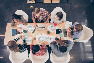 Top view of start-up multinational group of creative people havi