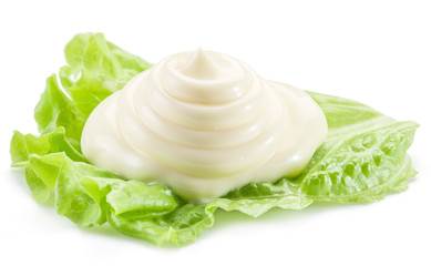 Natural mayonnaise sauce on the salad leaf.