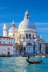 Grand Canal with gondola against Basilica Santa Maria della Salute in Venice, Italy