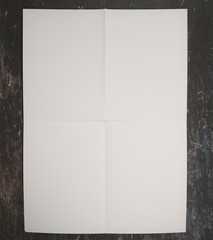 white paper on concrete surface