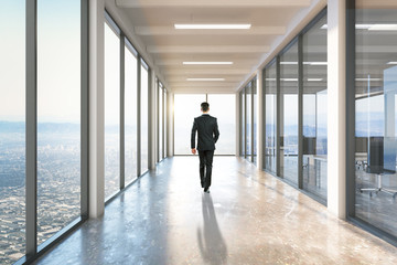 Businessman walking on corridor