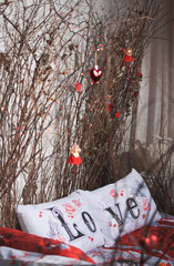 White love pillows with dark wild branches