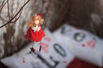 Red angel with star on a love pillow