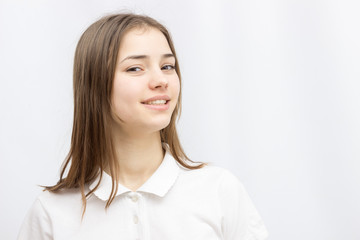 Close up portrait of pretty calm girl in white T-shirt