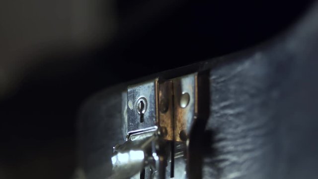 The man pulls out a guitar out of the case